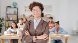 Primary school teacher and classroom students